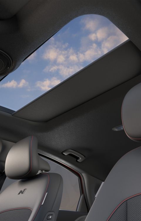 Hyundai IONIQ 6 with open sunroof.