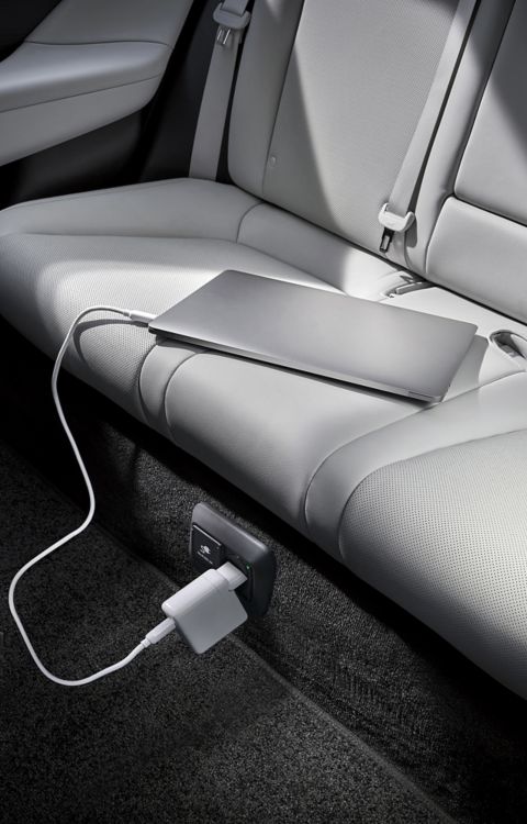  Laptop plugged into the on-board 230V socket of Hyundai IONIQ 6’s Vehicle-to-Load technology.