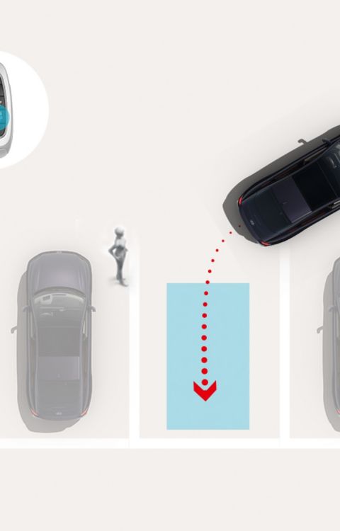 Remote Smart Parking Assist 2: Hyundai IONIQ 6 parks itself into a marked space via remote control while a pedestrian stands nearby.