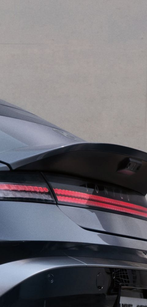 Hyundai IONIQ 6 rear view showing integrated spoiler and horizontal light bar