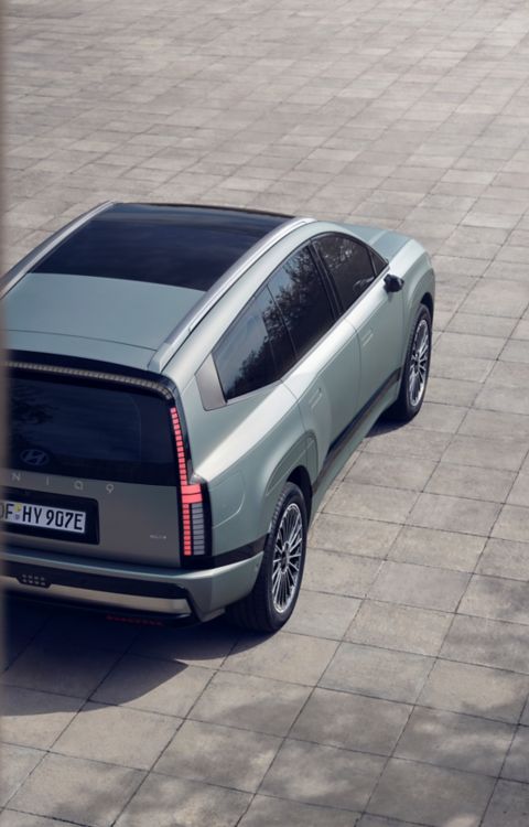 Hyundai IONIQ 9 seen from above while parked on an open paved area.