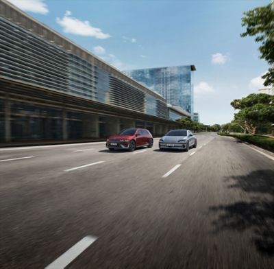 Hyundai IONIQ 5 and IONIQ 6 driving along the road.