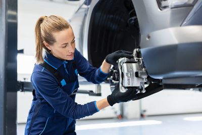 Hyundai mechanic checking the brakes of a Hyundai.