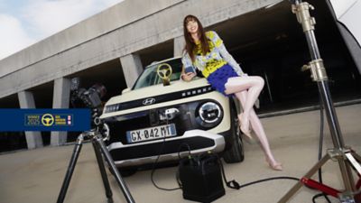 Hyundai Concept THREE on a moon-like surface under a starry sky, featuring a sleek design.